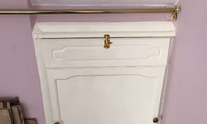 Curtain rail above door